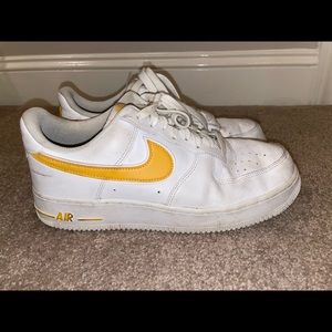Nike Air Force 1 trainers yellow swoosh